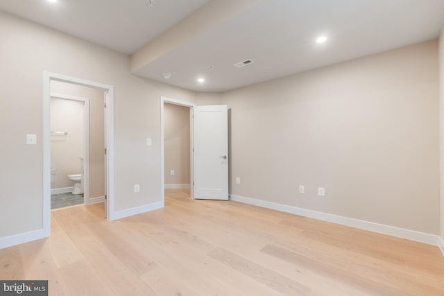 unfurnished bedroom featuring baseboards, recessed lighting, light wood-style flooring, and visible vents