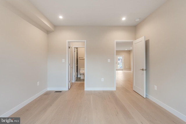 unfurnished bedroom with baseboards, light wood-style floors, and recessed lighting