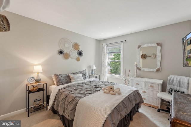 bedroom featuring light colored carpet