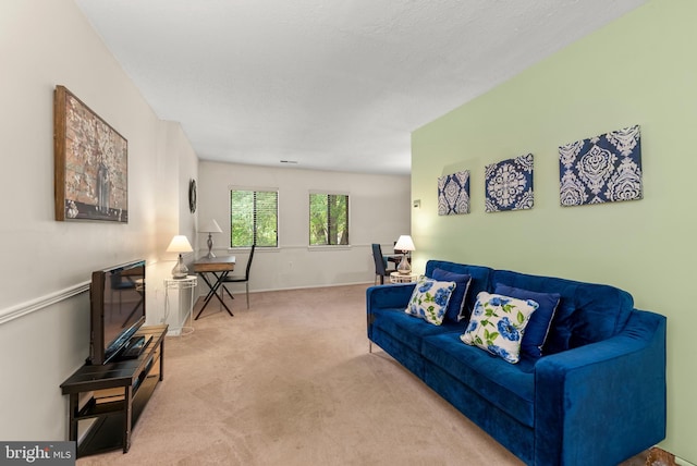 living room featuring carpet flooring and baseboards