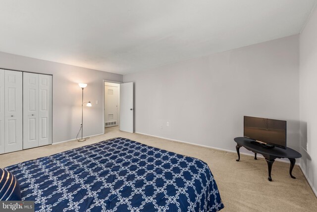 bedroom with carpet flooring and baseboards