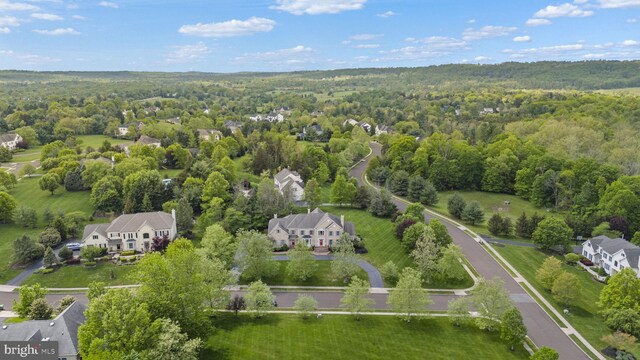 drone / aerial view of a heavily wooded area