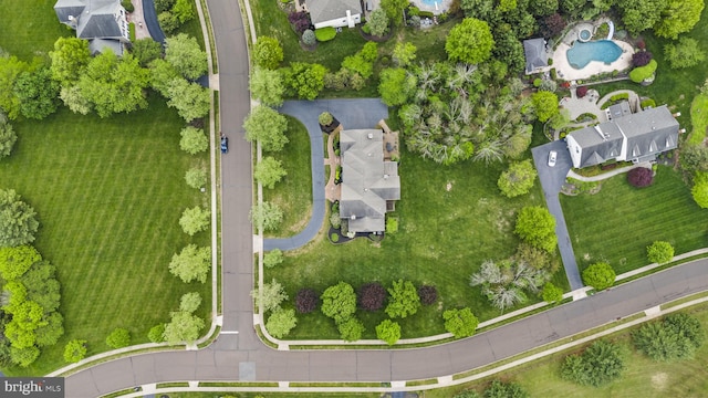 view of property location featuring a pool