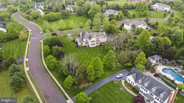 aerial view of residential area featuring a pool