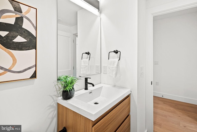 2811 S Hutchinson St, Philadelphia, PA 19148 - bathroom featuring vanity, wood finished floors, and baseboards