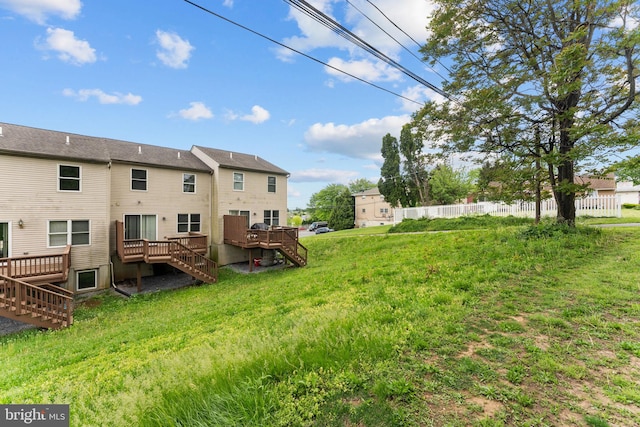 back of property with stairway and a wooden deck