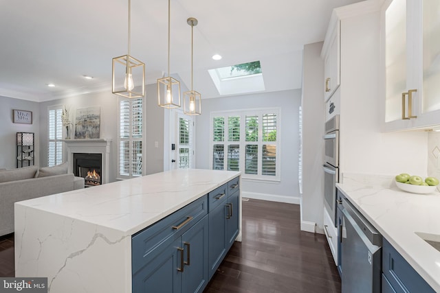 19599 Aspendale Sq, Ashburn, VA 20147 - kitchen featuring stainless steel appliances, blue cabinets, dark wood-style floors, healthy amount of natural light, and crown molding