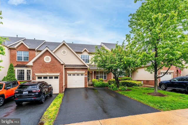 19599 Aspendale Sq, Ashburn, VA 20147 - multi unit property featuring brick siding, driveway, an attached garage, and a shingled roof