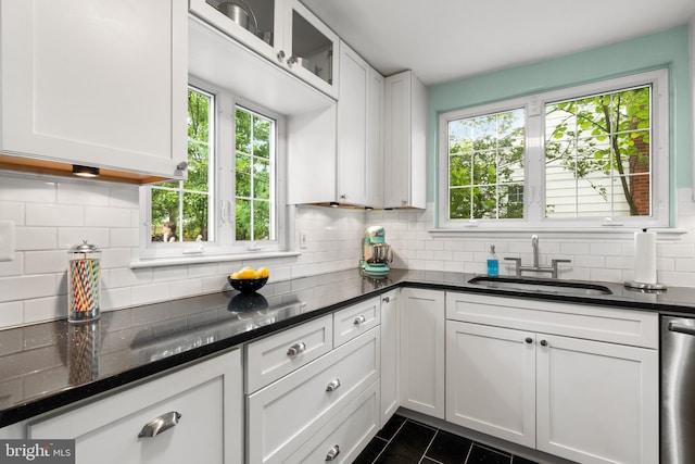 3210 Old Dominion Blvd, Alexandria, VA 22305 - kitchen featuring a sink, backsplash, plenty of natural light, and white cabinets