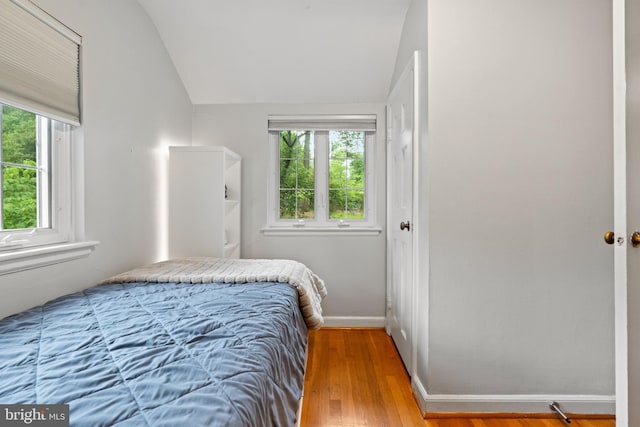 3210 Old Dominion Blvd, Alexandria, VA 22305 - bedroom featuring vaulted ceiling, wood finished floors, and baseboards