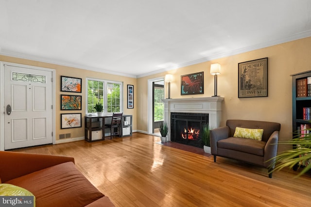 3210 Old Dominion Blvd, Alexandria, VA 22305 - living area with ornamental molding, a fireplace with flush hearth, wood finished floors, and baseboards