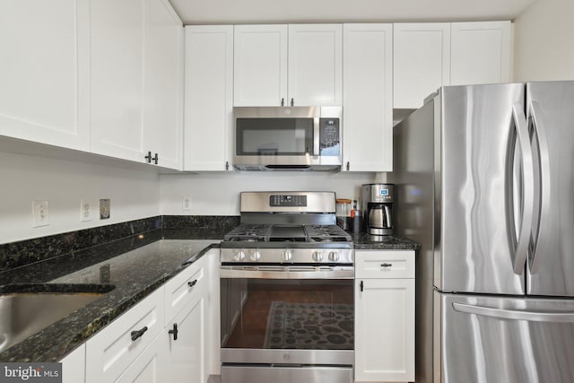 2120 Vermont Ave NW Unit 309, Washington, DC 20001 - kitchen featuring stainless steel appliances, white cabinetry, and dark stone countertops