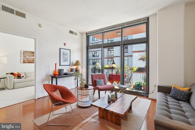 2120 Vermont Ave NW Unit 309, Washington, DC 20001 - living area featuring wood finished floors and floor to ceiling windows