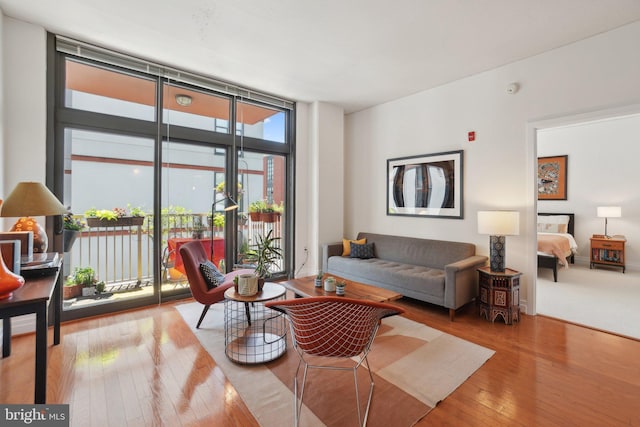 2120 Vermont Ave NW Unit 309, Washington, DC 20001 - living area with expansive windows and hardwood / wood-style flooring