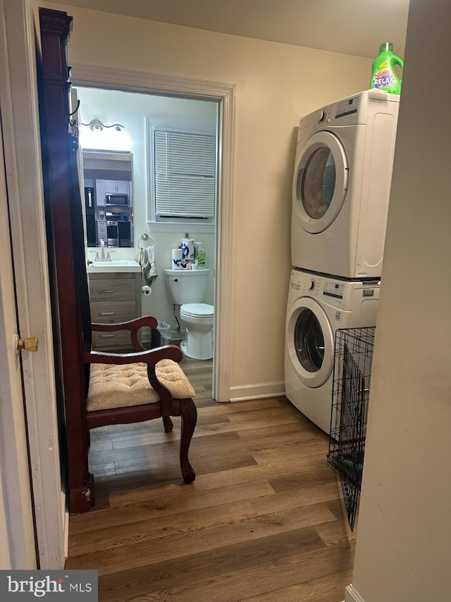 307 Congress Dr, Gibbstown, NJ 08027 - washroom featuring stacked washer / drying machine, wood finished floors, and baseboards
