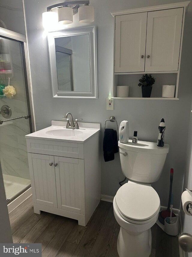 307 Congress Dr, Gibbstown, NJ 08027 - bathroom with a shower stall, wood finished floors, vanity, and toilet
