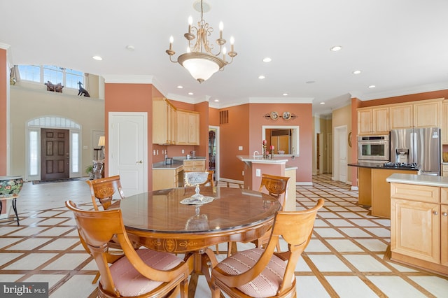 dining area featuring crown molding, a notable chandelier, baseboards, and recessed lighting