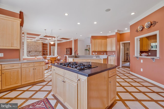 kitchen featuring crown molding, recessed lighting, light brown cabinets, and gas cooktop