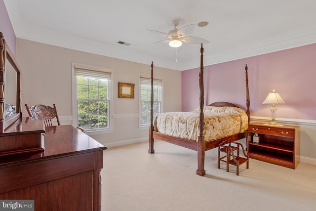 bedroom featuring baseboards, carpet flooring, visible vents, and a ceiling fan
