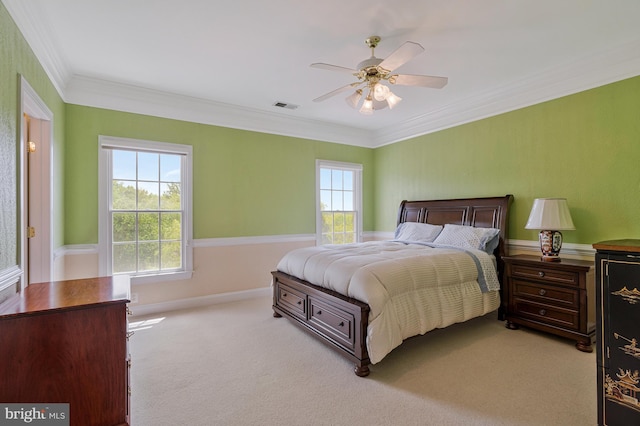 bedroom with crown molding, carpet, ceiling fan, and visible vents