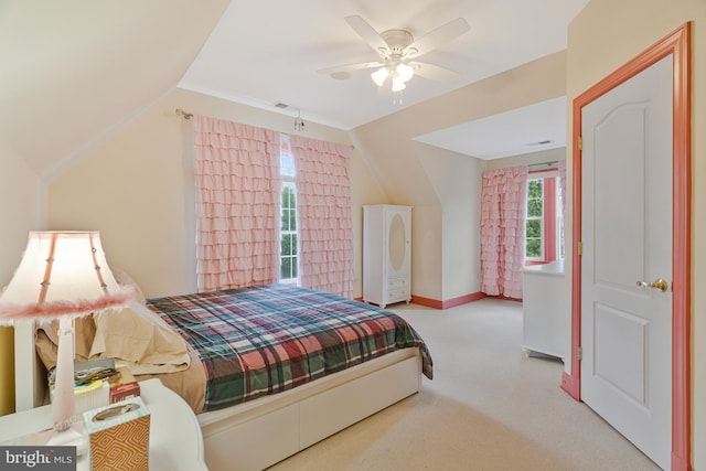 bedroom with visible vents, vaulted ceiling, carpet floors, a ceiling fan, and baseboards