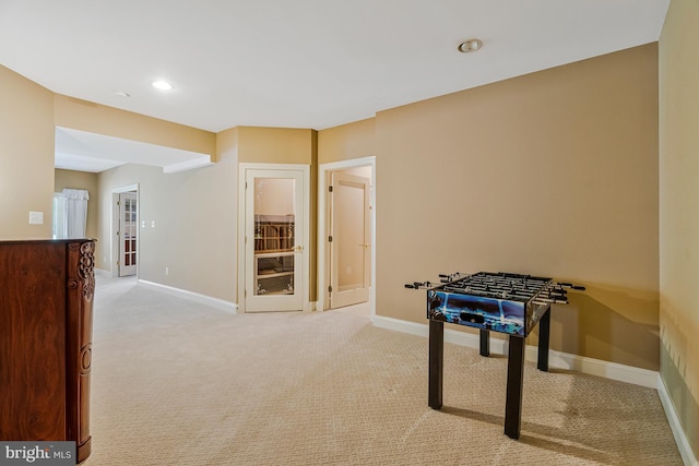 game room with baseboards, light carpet, and recessed lighting
