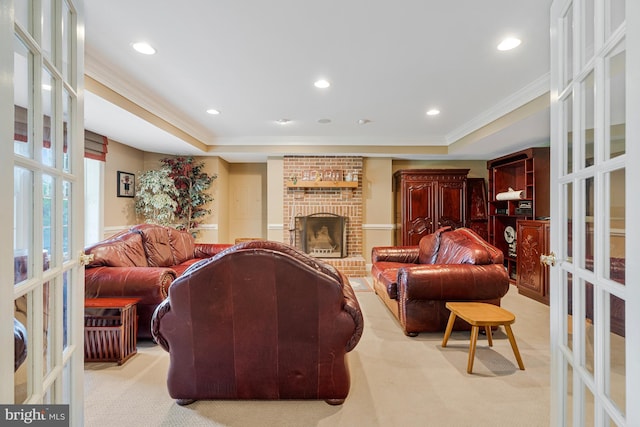 living area with light colored carpet, french doors, ornamental molding, and recessed lighting