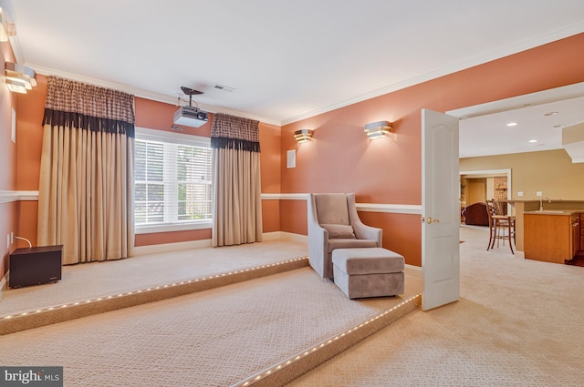 living area with ornamental molding, visible vents, recessed lighting, carpet floors, and baseboards