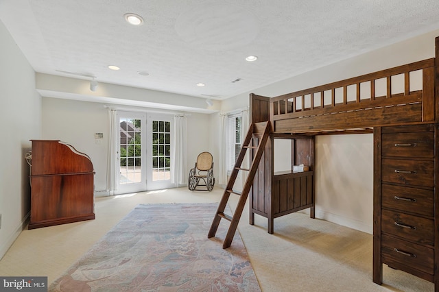 bedroom featuring access to outside, french doors, recessed lighting, and light colored carpet