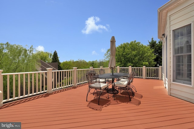 deck with outdoor dining area