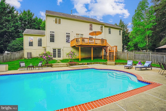 view of swimming pool featuring stairway, a deck, and a patio area
