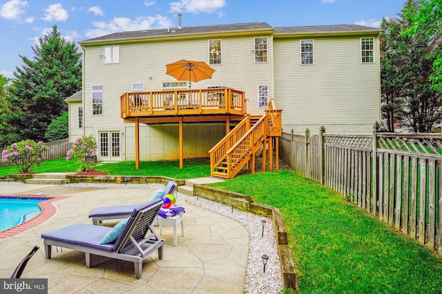 back of house featuring a deck, a patio, and stairway
