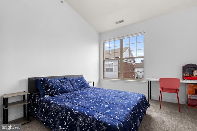 bedroom featuring carpet, lofted ceiling, and baseboards