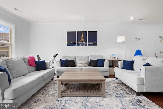 living room with ornamental molding, wood finished floors, and recessed lighting