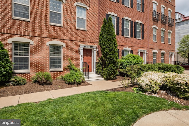 view of front of home with brick siding