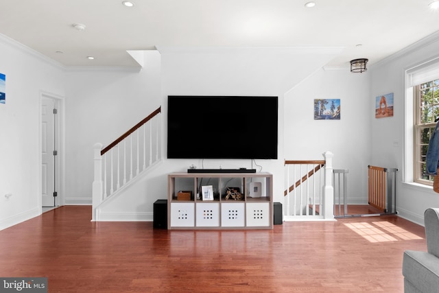 living room featuring ornamental molding, wood finished floors, baseboards, recessed lighting, and stairs
