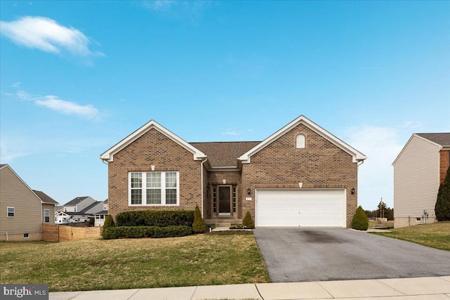 ranch-style house with brick siding, fence, an attached garage, a front yard, and aphalt driveway