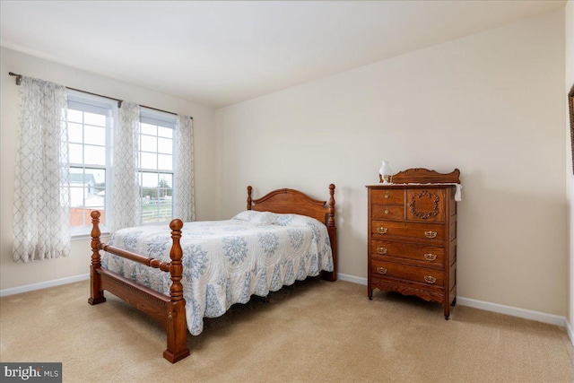 bedroom featuring baseboards and carpet floors