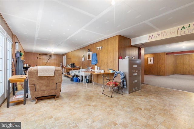 living area featuring wood walls