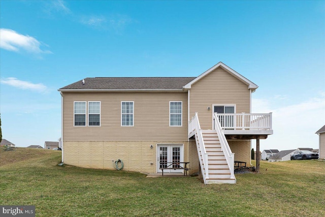 back of property featuring a yard, stairway, and a deck