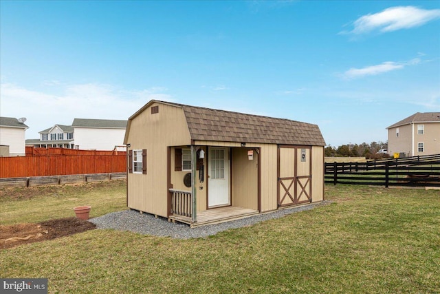view of shed featuring a fenced backyard
