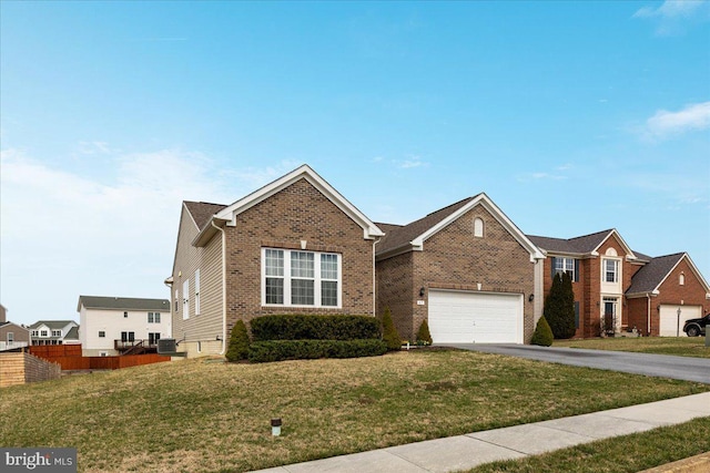 ranch-style house with aphalt driveway, fence, brick siding, a front lawn, and central AC unit