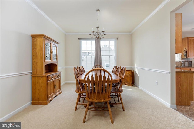 dining room featuring ornamental molding, a chandelier, and light colored carpet
