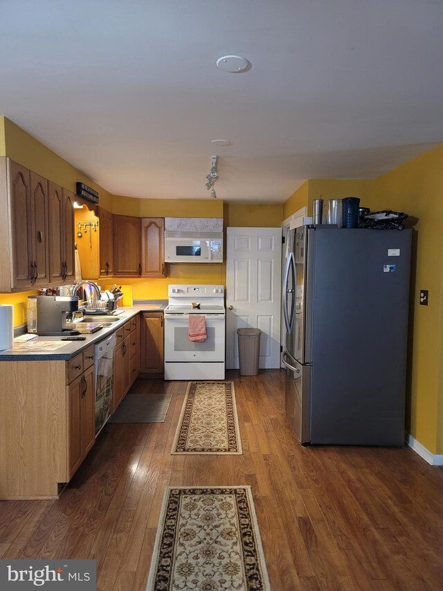 70 W Hamlin Ave, Telford, PA 18969 - kitchen featuring white appliances, dark wood-style floors, light countertops, and a sink