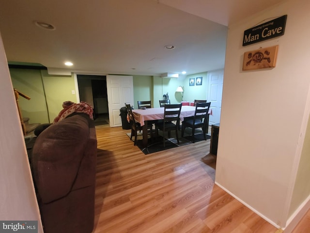 dining space with stairs, baseboards, recessed lighting, and light wood-style floors