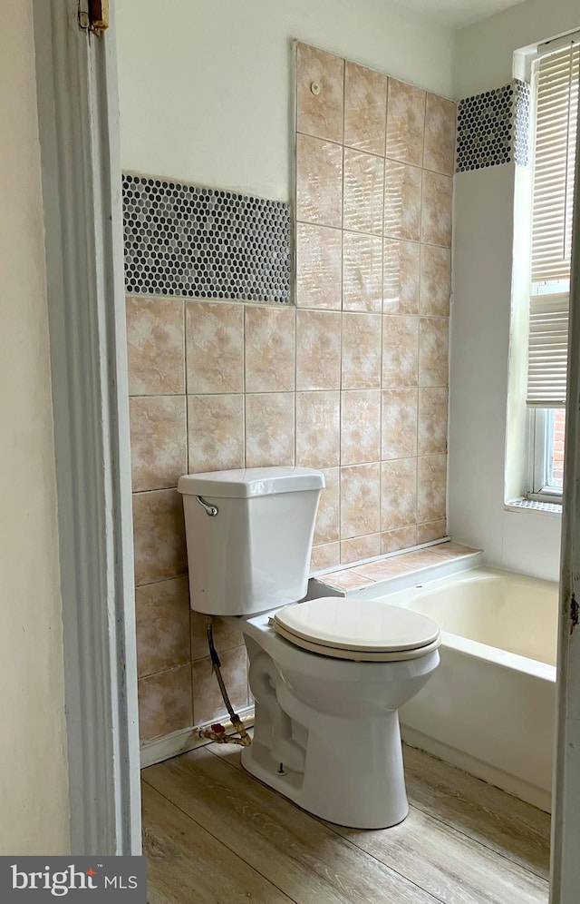 2008 E Orleans St, Philadelphia, PA 19134 - full bath featuring toilet, wood finished floors, tile walls, and a bathtub