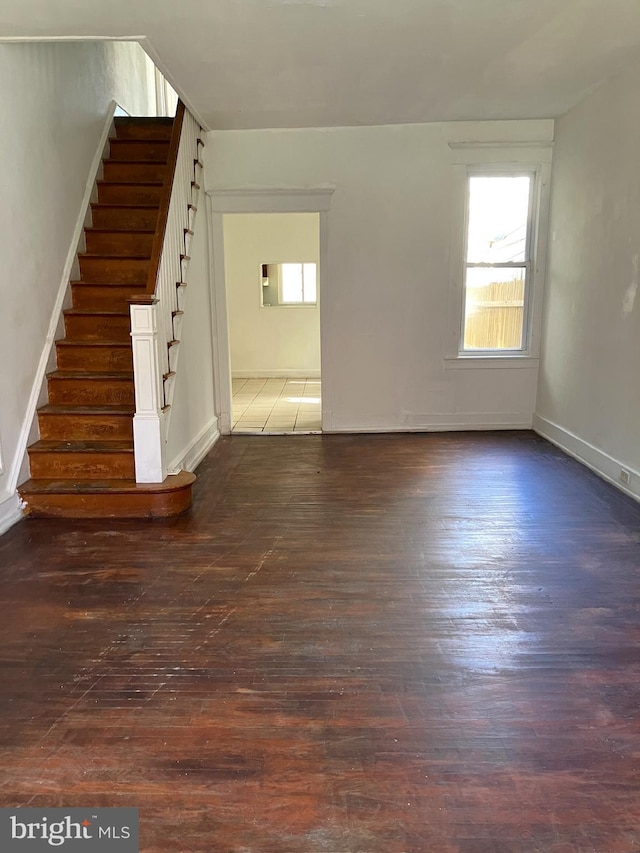 2008 E Orleans St, Philadelphia, PA 19134 - unfurnished living room with stairway and dark wood-style floors