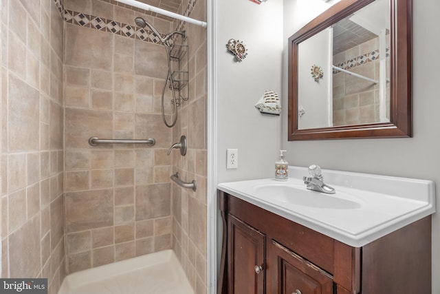 full bath featuring a stall shower and vanity