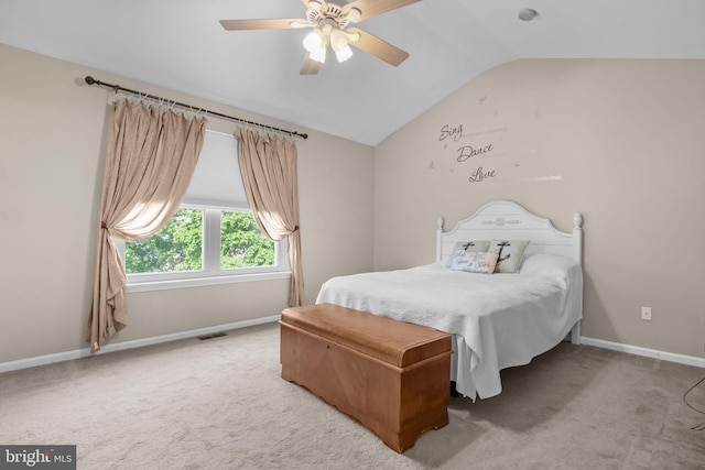 bedroom featuring lofted ceiling, carpet, baseboards, and a ceiling fan