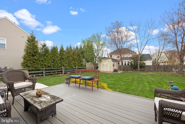 wooden deck with a shed and an outbuilding
